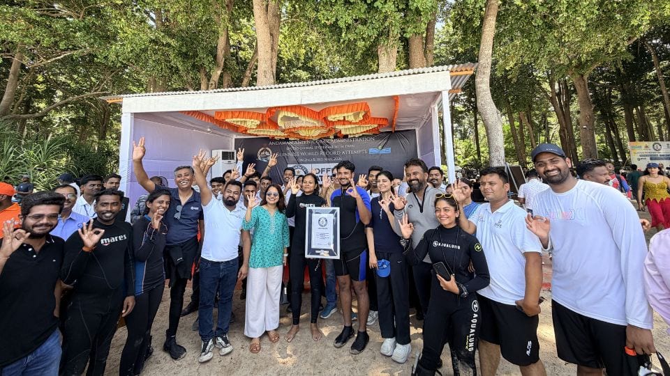 The Aqua Nomads team and divers gathered after a record attempt on the beach